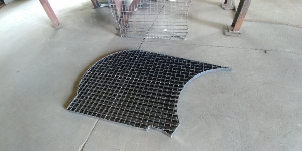 a metal grate on the floor